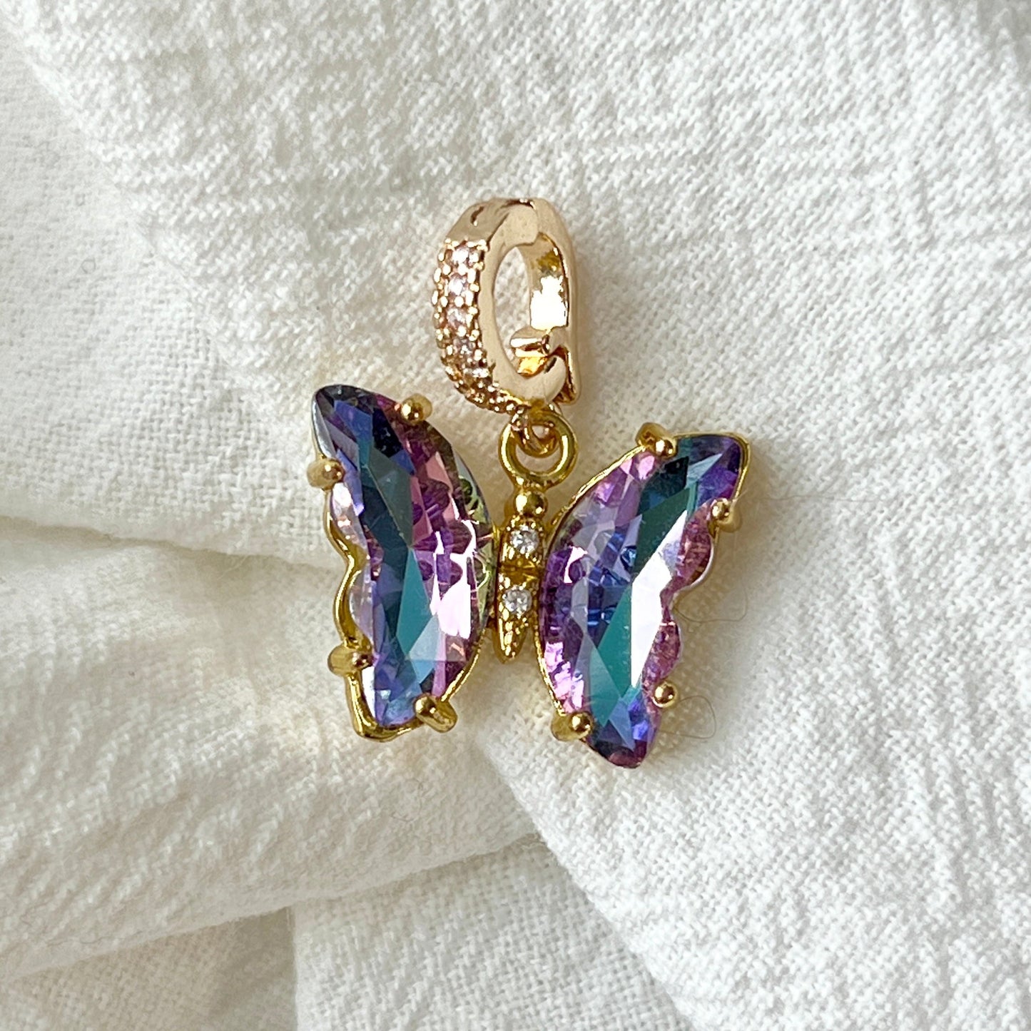 Shop the Almond 14K Thicker Gold Microset Zircon Stone Radiant Butterfly Charm—a stunning piece that combines elegance and charm. This exquisite butterfly design features microset zircon stones that sparkle with every movement, set in 14K thicker gold plating for a luxurious, long-lasting finish. Perfect for adding a touch of grace and sophistication to any outfit, this radiant butterfly charm symbolizes transformation, beauty, and freedom. Ideal for those who appreciate intricate craftsmanship and unique,